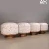 Pebble Stitch Pouf Stool with Wood Plinth Base