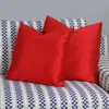 Navy Checkered Track-Arm Sofa with Red Accent Cushions