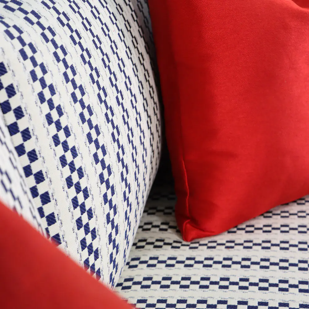 Navy Checkered Track-Arm Sofa with Red Accent Cushions