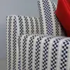 Navy Checkered Track-Arm Sofa with Red Accent Cushions