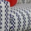 Navy Checkered Track-Arm Sofa with Red Accent Cushions
