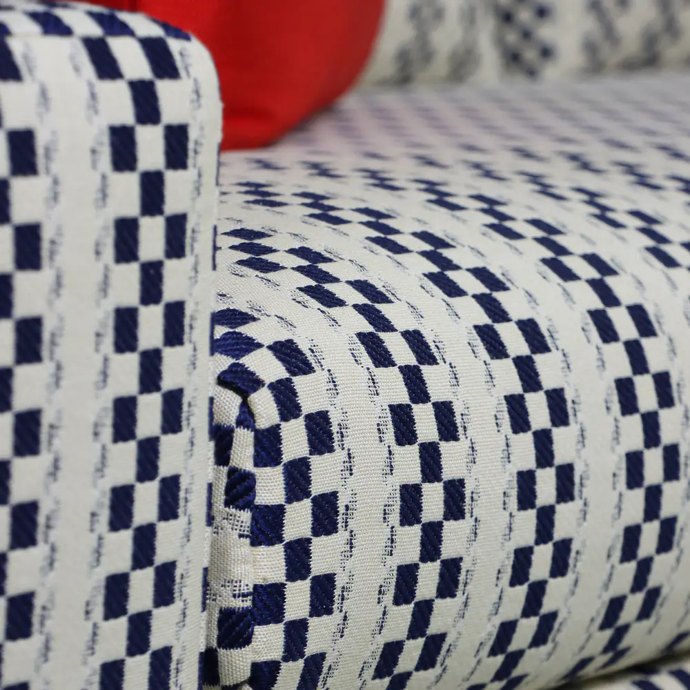 Navy Checkered Track-Arm Sofa with Red Accent Cushions